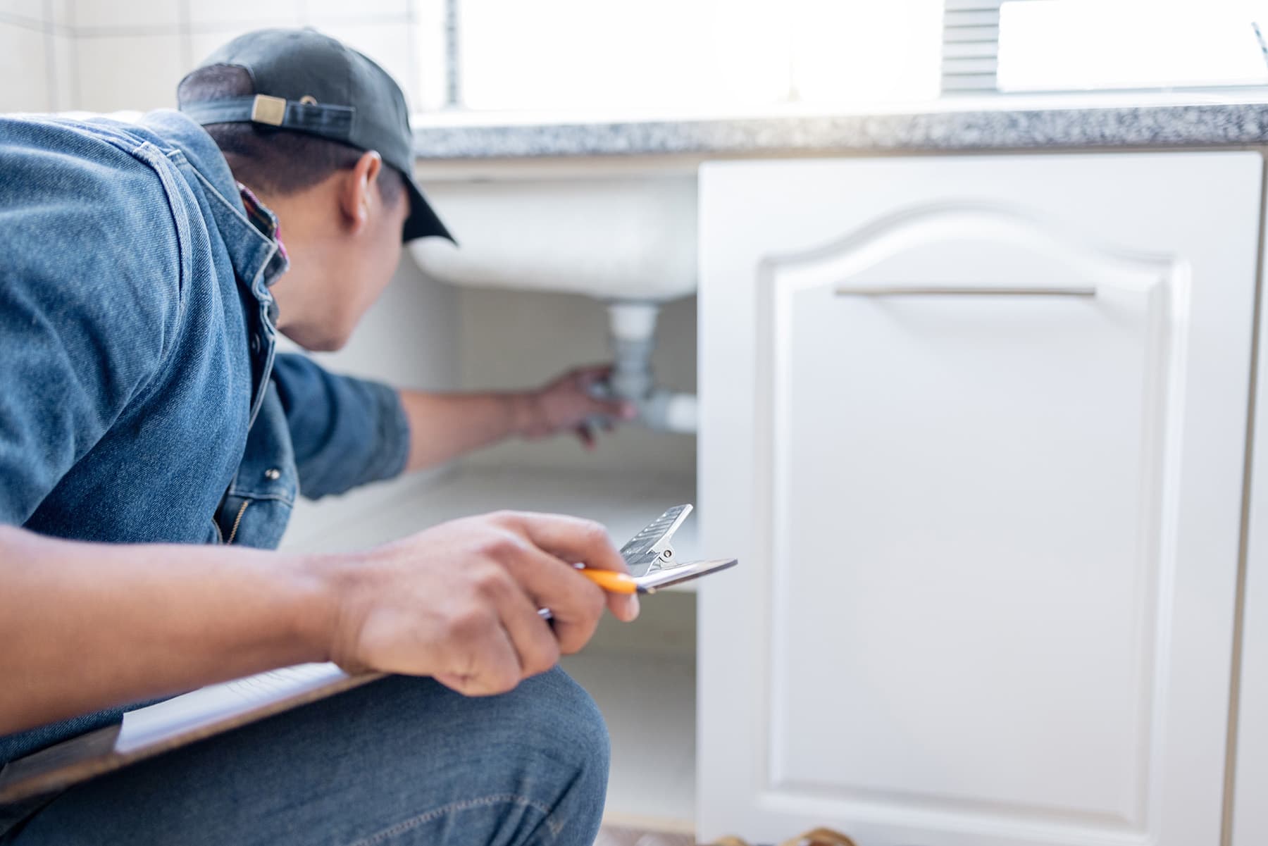 Maple Ridge Restoration technician assessing water damage